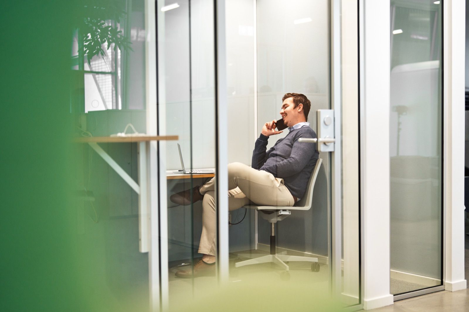 A Scribill advisor sits in a meeting room taking a first call with a company